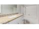 Bathroom vanity with granite countertops and a tub with shower at 2201 S Evergreen Rd, Tempe, AZ 85282