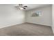 Bedroom showcasing neutral walls, carpet, and a large window to let the natural light in at 2201 S Evergreen Rd, Tempe, AZ 85282