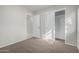 Bedroom featuring a doorway, closet and neutral carpeting at 2201 S Evergreen Rd, Tempe, AZ 85282