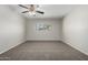 Cozy bedroom with neutral walls, plush carpet, and a window to allow natural light at 2201 S Evergreen Rd, Tempe, AZ 85282