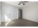 Bedroom featuring a ceiling fan and sliding door closet at 2201 S Evergreen Rd, Tempe, AZ 85282