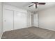 Bedroom with sliding door closet, ceiling fan and neutral colors at 2201 S Evergreen Rd, Tempe, AZ 85282