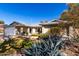 Charming single-story home featuring a well-manicured lawn, desert landscaping, and a two-car garage at 2201 S Evergreen Rd, Tempe, AZ 85282