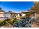 Charming single-story home featuring a well-manicured lawn, desert landscaping, and a two-car garage at 2201 S Evergreen Rd, Tempe, AZ 85282