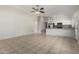 Spacious living room with open floor plan and tile flooring, flowing into the adjacent kitchen area at 2201 S Evergreen Rd, Tempe, AZ 85282