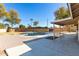 View of the private backyard pool surrounded by patio and landscaped area for relaxation and entertainment at 2201 S Evergreen Rd, Tempe, AZ 85282