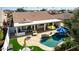 Aerial view showcasing the property's pool, outdoor kitchen, and expansive backyard at 24416 S Lakestar Dr, Sun Lakes, AZ 85248