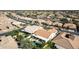 Expansive aerial view of a residential neighborhood with well-maintained homes and lush green landscaping at 24416 S Lakestar Dr, Sun Lakes, AZ 85248