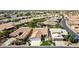 Lovely aerial view of the property in its neighborhood featuring mature landscaping and a traditional tile roof at 24416 S Lakestar Dr, Sun Lakes, AZ 85248