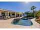 Stunning backyard with refreshing pool, shaded patio, and lush tropical landscaping at 24416 S Lakestar Dr, Sun Lakes, AZ 85248