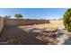 Low maintenance backyard with gravel, block wall, and desert landscaping at 2640 S Los Altos Dr, Chandler, AZ 85286