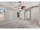 Bedroom features carpeted floors, neutral walls, a ceiling fan, and a large window at 2640 S Los Altos Dr, Chandler, AZ 85286