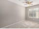 Neutral bedroom featuring carpet, a ceiling fan, and a window for natural light at 2640 S Los Altos Dr, Chandler, AZ 85286