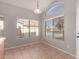 Cozy dining area featuring tile flooring, a contemporary light fixture and bright natural light at 2640 S Los Altos Dr, Chandler, AZ 85286