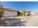 A well-maintained home with a two-car garage and a beautiful cactus in the rock landscaping at 2640 S Los Altos Dr, Chandler, AZ 85286