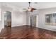 Expansive living room boasting rich wood flooring, soaring ceilings, and a decorative fan at 2640 S Los Altos Dr, Chandler, AZ 85286