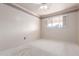 Bedroom features neutral carpet, white walls with border, ceiling fan, and window with shutters at 2806 W Marshall Ave, Phoenix, AZ 85017