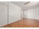 Bedroom featuring a wood floor, white painted walls and white trim at 2806 W Marshall Ave, Phoenix, AZ 85017