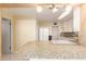 A kitchen featuring granite countertops, white appliances, and white cabinets at 2806 W Marshall Ave, Phoenix, AZ 85017