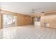 Open-concept living area with tile floors, sliding door to patio, and a view into the kitchen at 2806 W Marshall Ave, Phoenix, AZ 85017