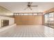 Bright living area featuring a white brick fireplace and access to outdoor space through sliding glass doors at 2806 W Marshall Ave, Phoenix, AZ 85017