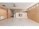 Spacious living room with tile flooring, built in shelving, and a brick fireplace at 2806 W Marshall Ave, Phoenix, AZ 85017