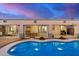 Beautiful backyard with a pristine pool and covered patios for entertaining at 29983 W Fairmount Ave, Buckeye, AZ 85396