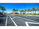 Road leading to Tartesso entrance sign framed by palm trees at 29983 W Fairmount Ave, Buckeye, AZ 85396