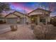 Inviting single-story home showcasing a three-car garage, low-maintenance landscaping, and a covered porch at 29983 W Fairmount Ave, Buckeye, AZ 85396