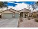 Beautiful single-story home with a three-car garage, neutral stucco, and a well-manicured desert landscape at 29983 W Fairmount Ave, Buckeye, AZ 85396