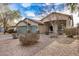 Attractive single-story home with a three-car garage and a low maintenance, drought-tolerant yard at 29983 W Fairmount Ave, Buckeye, AZ 85396