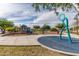 Fun playground with a water fountain feature, colorful spring riders, a covered play structure, and a swing set at 29983 W Fairmount Ave, Buckeye, AZ 85396