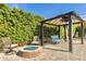 Backyard with a fire pit, pergola, and seating, perfect for entertaining guests at 3007 N 47Th St, Phoenix, AZ 85018