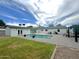 Inviting backyard features a sparkling pool, manicured lawn, and a spacious patio perfect for outdoor entertaining at 3007 N 47Th St, Phoenix, AZ 85018