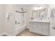 Bathroom featuring a bathtub with shower and modern gray vanity with decorative mirror at 3007 N 47Th St, Phoenix, AZ 85018