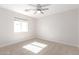 Bright, empty bedroom with a ceiling fan and carpeted floor at 3007 N 47Th St, Phoenix, AZ 85018