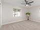 Bright, empty bedroom with a ceiling fan and carpeted floor at 3007 N 47Th St, Phoenix, AZ 85018