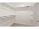 Walk-in closet with built-in shelving and a carpeted floor at 3007 N 47Th St, Phoenix, AZ 85018