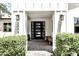 Inviting entryway with modern front door, brick pavers, and stylish lighting fixtures at 3007 N 47Th St, Phoenix, AZ 85018