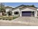 Charming, modern white home featuring a navy blue garage door and a lush, green lawn at 3007 N 47Th St, Phoenix, AZ 85018