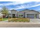 Charming home exterior with a well-manicured lawn, modern gray paint, and a wood fence at 3007 N 47Th St, Phoenix, AZ 85018