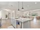 Bright, open kitchen featuring a large center island with quartz countertops and modern lighting at 3007 N 47Th St, Phoenix, AZ 85018