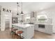 Modern kitchen features gray cabinets, stainless steel appliances, a center island, and stylish pendant lighting at 3007 N 47Th St, Phoenix, AZ 85018