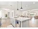 Bright open concept showcasing kitchen island connecting to dining and living spaces at 3007 N 47Th St, Phoenix, AZ 85018