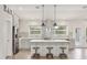 Bright kitchen with gray cabinets, stainless steel appliances, an island, and decorative backsplash at 3007 N 47Th St, Phoenix, AZ 85018