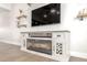 Cozy living room featuring a modern fireplace, stylish shelves and lots of natural light at 3007 N 47Th St, Phoenix, AZ 85018