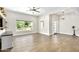 Bright living room with wood-look tile flooring, large windows, and modern decor at 3007 N 47Th St, Phoenix, AZ 85018