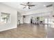 Spacious living room featuring wood-look tile flooring and an open floor plan at 3007 N 47Th St, Phoenix, AZ 85018