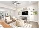 Open-concept living room featuring tile floors, a modern ceiling fan and lots of natural light at 3007 N 47Th St, Phoenix, AZ 85018