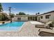 Backyard pool with lounge seating and modern exterior design with windows providing natural light at 3007 N 47Th St, Phoenix, AZ 85018
